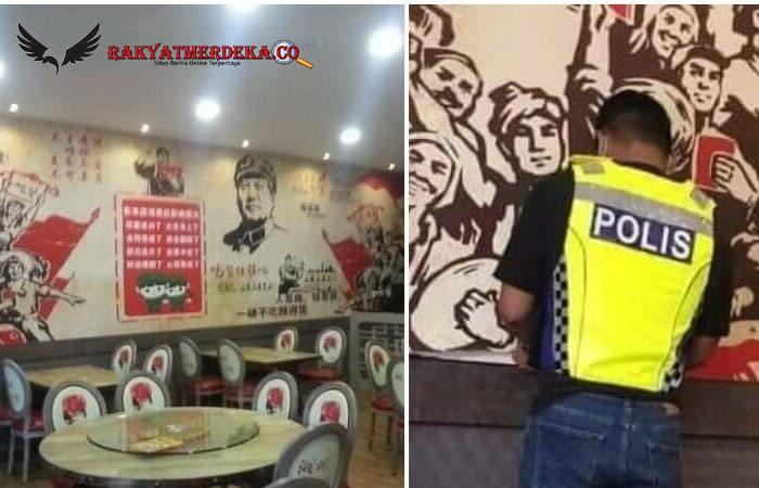 Foto Viral Polisi Malaysia Copot Stiker Komunis dari Sebuah Restoran